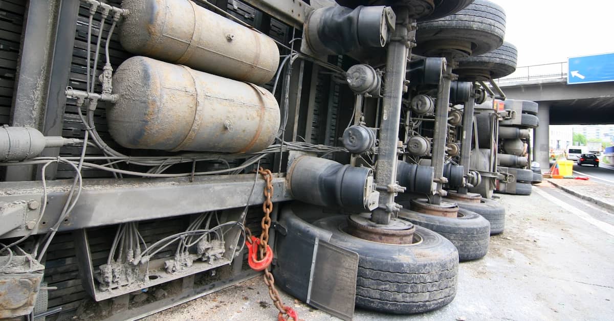 an 18-wheeler on its side after a truck accident | Oliver Law Firm